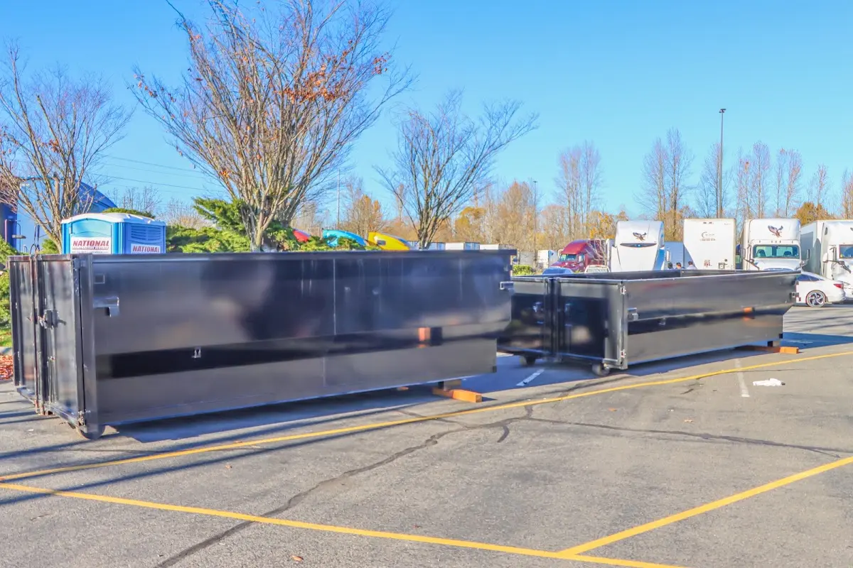 Professional dumpster rental service with roll-off container on residential driveway in South Milwaukee
